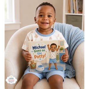 May include: A hardcover children's book titled Michael Goes on the Potty! featuring a cartoon illustration of a young child standing next to a potty, a teddy bear in a basket, and blue bathroom decor. The book cover has a white background.