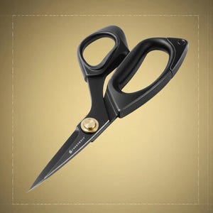 May include: A pair of black scissors with ergonomic handles and a gold-toned central pivot screw. The blades are matte black, and the word "CURRENTSIN" is printed in white near the pivot point. The design features a sleek, solid construction.