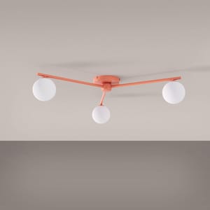 May include: A ceiling light fixture featuring a coral-colored metal frame with three extending arms. Each arm terminates in a spherical, frosted white glass globe shade. The central circular mount attaches the fixture to the ceiling surface.