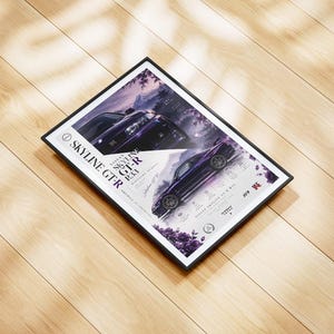 May include: A framed poster featuring a dark purple Nissan Skyline GT-R R33. The design includes the text Skyline GTR, Midnight Purple, and Japanese characters, set against a backdrop of purple flowers and a mountain silhouette.