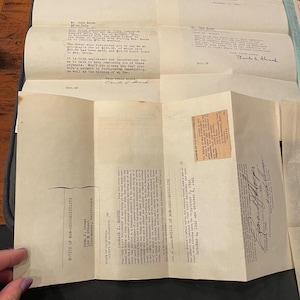 May include: A collection of vintage off-white legal documents from 1941, including typed correspondence addressed to Mr. John Sousa and a formal Notice of Non-Responsibility printed in black ink, featuring handwritten signatures and official stamps.