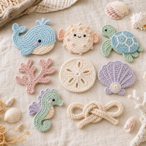 May include: A collection of eight crocheted ocean-themed appliques including a light blue whale, a peach pufferfish, a green and blue sea turtle, a pink coral branch, a cream sand dollar, a purple seashell, a green seahorse, and a cream rope knot.