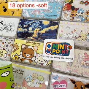 May include: A collection of soft protective cases for handheld gaming consoles featuring various character designs including Pikachu, Rilakkuma, Sumikko Gurashi, and Eevee, with a white rectangular sign displaying the Mint Point Gaming logo.