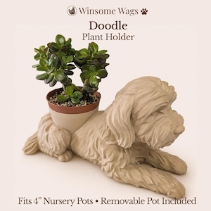 May include: A beige dog-shaped plant holder with a textured coat, featuring a removable pot containing a green succulent. The text reads: Winsome Wags Doodle Plant Holder. Fits 4" Nursery Pots • Removable Pot Included.