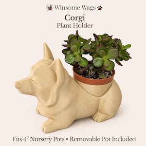 May include: A beige Corgi-shaped plant holder with a textured finish, featuring the text Winsome Wags Corgi Plant Holder and Fits 4 inch Nursery Pots Removable Pot Included. A green succulent plant is potted inside the removable brown plastic container.