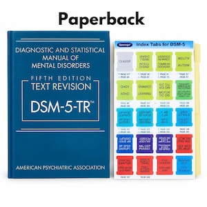 May include: A blue Diagnostic and Statistical Manual of Mental Disorders Fifth Edition Text Revision DSM-5-TR paperback book by the American Psychiatric Association next to a sheet of colorful adhesive index tabs for the manual.