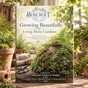 May include: A hardcover book titled Growing Beautifully Living Moss Gardens by Boxcroft Garden & Designs. The cover features a rustic clay olla planter overflowing with lush green moss and ferns, set against a blurred garden background.