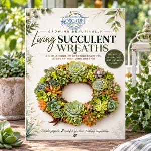 May include: A book titled Living Succulent Wreaths with a cover featuring a circular wreath made of various green, orange, and purple succulents. The text includes Boxcroft Garden & Designs, Growing Beautifully, and Step-by-step instructions for stunning results.