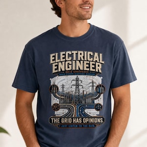 May include: A navy blue short-sleeve t-shirt featuring a graphic print with the text "ELECTRICAL ENGINEER", "GRID ENGINEERS", "POWER SYSTEMS ELECTRICAL ENGINEERS", "THE GRID HAS OPINIONS.", and "I JUST LISTEN TO THE DATA." with power line imagery.