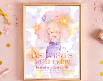 May include: A framed invitation for Astraea's 1st birthday, featuring a watercolor mermaid illustration. The design includes a pink-haired mermaid, bubbles, and the event details: December 1, 2026, at 3 PM.