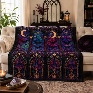 May include: A rectangular throw blanket featuring a repeating stained glass window pattern in shades of purple, blue, and black. The design includes arched frames, yellow crescent moons, and star motifs, all bordered by a thick black crocheted edge.
