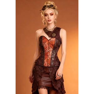 May include: A brown and orange corset top featuring a one-shoulder design with a layered scale-like skirt. The garment includes a metallic gear-shaped accent on the shoulder, a patterned orange center panel, and a dark brown bodice with trim.