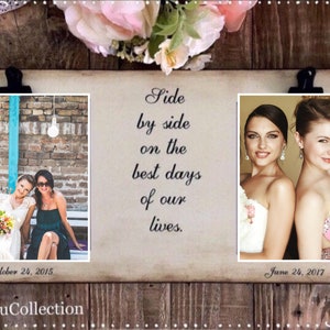 May include: A wood picture frame with two photos of two women in wedding attire. The text "Side by side on the best days of our lives." is printed on the frame. The dates "October 24, 2015" and "June 24, 2017" are printed below the photos.