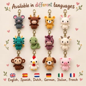 May include: A collection of twelve crocheted animal keychains arranged in a grid, featuring a gray mouse, brown ox, yellow tiger, white rabbit, teal dragon, green snake, purple horse, white goat, brown monkey, white chicken, brown dog, and pink pig.