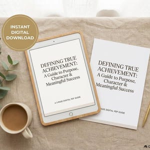 May include: A digital tablet and a printed document both displaying the text Defining True Achievement: A Guide to Purpose, Character & Meaningful Success. A coffee mug, a gold pen, and paper clips are arranged alongside the items.