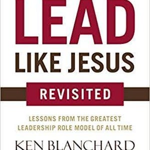 May include: A book cover with a white background featuring the title LEAD LIKE JESUS in large dark red and black letters. The subtitle REVISITED is in white text on a dark red horizontal bar. Authors Ken Blanchard, Phil Hodges, and Phyllis Hendry.