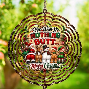 May include: A circular metal wind spinner featuring a Christmas theme with a graphic of Santa, a reindeer, a snowman, a gingerbread person, and an elf facing away. The text reads We Wish You NOTHING BUTT... A Merry Christmas in red and black.