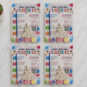May include: Four identical paint your own plaster kits in clear plastic packaging. Each kit includes a white plaster princess figurine, a thin paintbrush, and three small circular paint pots in purple, pink, and yellow, with printed instructions.