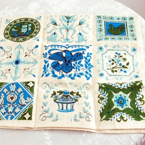 Vintage linen tea towel blue printed Pennsylvania Dutch designs with patriotic scenes