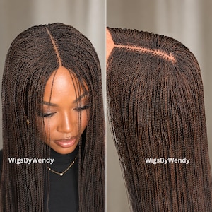 May include: A dark brown wig featuring micro-braided hair with a center part. The fine, uniform braids extend from the scalp, creating a sleek, textured appearance. The text WigsByWendy is visible on the lower portion of the image.