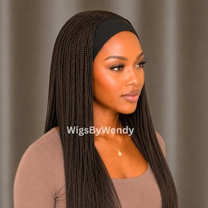 May include: A dark brown braided wig featuring long, thin, uniform micro-braids that fall straight down. The wig includes a wide, solid black fabric headband integrated at the hairline. The text WigsByWendy is visible in white on the hair.