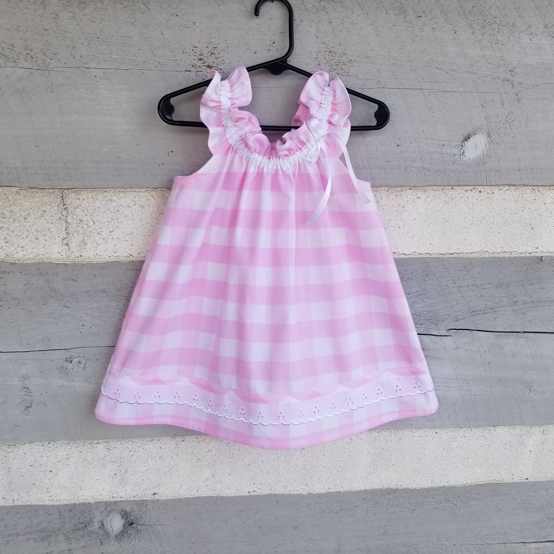 Simply sweet toddler and doll dresses handmade of pink check 100% cotton trimmed with white eyelet lace. Easy on and off, size 1/2T to 4T.