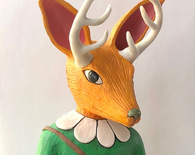 Unusual antlered animal figure in ceramic.