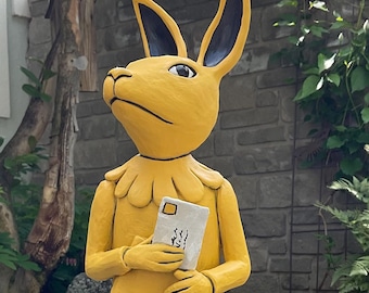 Rabbit child with book.