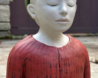 Goblin boy with an unusual hat.