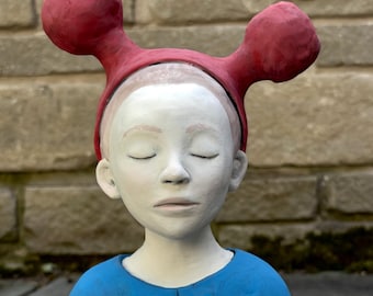Figure study of girl with unusual hat.