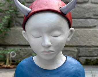 Figure with horns.