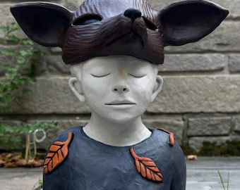 Figure study of woman with animal visor.