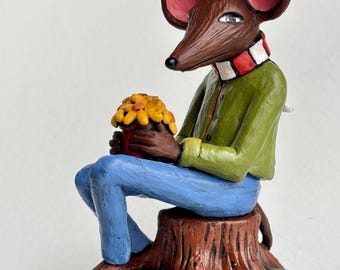 Mouse with yellow flowers.