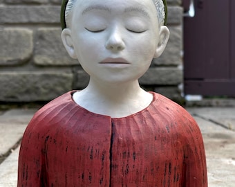 Figure study of a boy with an unusual hat.