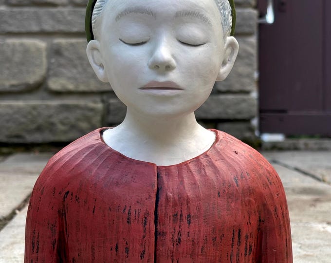 Figure study of a boy with an unusual hat.