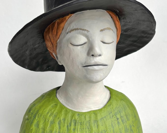 Boy with wide brimmed hat.