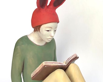Rabbit woman reading.