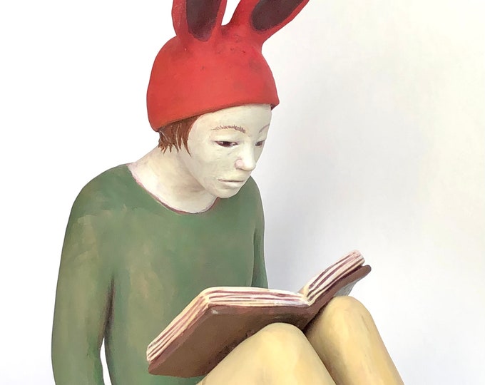 Rabbit woman reading.