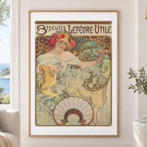 May include: A framed vintage poster titled Biscuits Lefèvre-Utile featuring an illustration of a person with red flowers in their hair holding a plate of biscuits. The artwork includes the year 1897 and decorative flowing lines in muted tones.