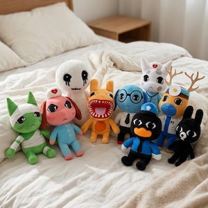May include: A collection of nine plush toys featuring various characters, including a green cat with bandages, a pink dog in a nurse outfit, a white ghost-like figure, an orange creature with a wide mouth, a blue dog, a black police officer duck, and a deer.