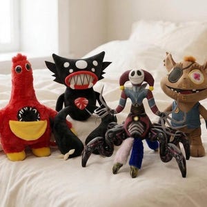 May include: Four plush toys: a red creature with a yellow belly and toothy mouth, a black horned monster with a wide toothy grin, a multi-limbed jester figure with a white mask, and a brown cat-like character wearing a blue vest.