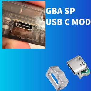 May include: A GBA SP USB C MOD kit featuring a clear plastic housing and a metallic USB-C port component. The image displays the installed port within a transparent console shell and the individual hardware parts separately on a blue background.
