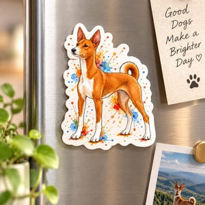 May include: A die-cut sticker featuring a brown and white Basenji dog with pointed ears and a curled tail, set against a colorful watercolor splash background. Next to it is a note with the text Good Dogs Make a Brighter Day.