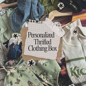 May include: A collection of assorted clothing items including a green floral vest with butterfly prints, a cream-colored zip-up sweater with green stripes, and blue denim fabric. A central paper note features the text Personalized Thrifted Clothing Box.