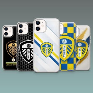 May include: Five smartphone cases featuring the Leeds United Football Club crest. Designs include a black case with gold text, a black honeycomb pattern, a white case with diagonal stripes, a blue and yellow checkerboard, and a white brushstroke design.