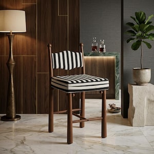 May include: A wooden stool featuring a backrest and seat cushion upholstered in a black and white striped fabric. The stool has four cylindrical legs connected by a cross-brace support structure, with small decorative spheres atop each leg post.