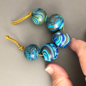 Set of 5 round blown hollow glass beads with swirled turquoise, blue lines for jewelry making, handmade lampwork