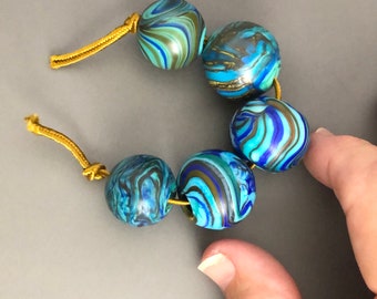 Set of 5 round blown hollow glass beads with swirled turquoise, blue lines for jewelry making, handmade lampwork