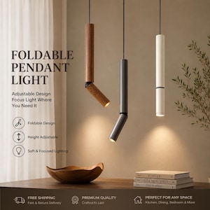 May include: Three cylindrical pendant lights hanging from black cords. One light is wood-toned, one is dark gray, and one is white. Each fixture features a hinged joint allowing the lower section to fold and adjust the direction of the light beam.