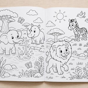 An open coloring book featuring black and white line art of safari animals including an elephant, rhinoceros, zebra, and lion in a natural landscape with trees, flowers, and butterflies, surrounded by several colored pencils.